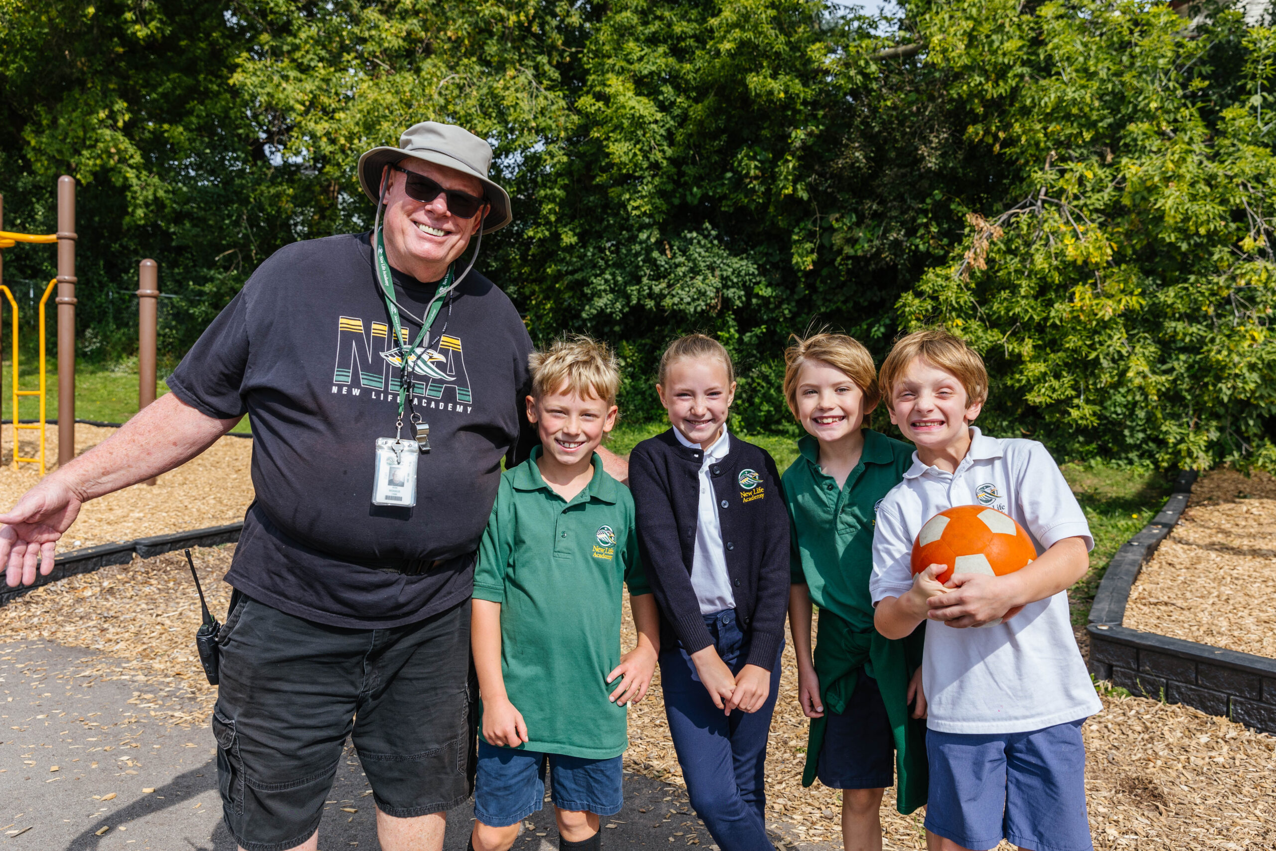 A group of happy girls enjoy a playful moment on the playground.