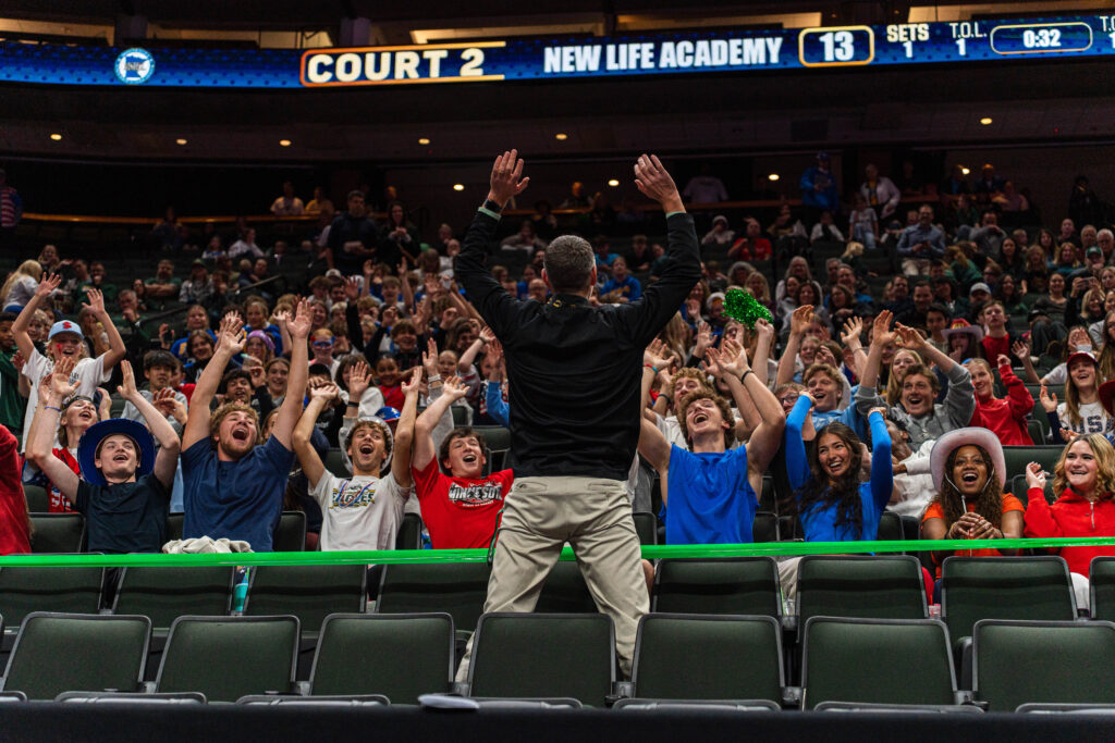 New Life Academy Fans Cheer on the Girls Varsity Volleyball Team at the State 2025-2026 Tournament led by their principal