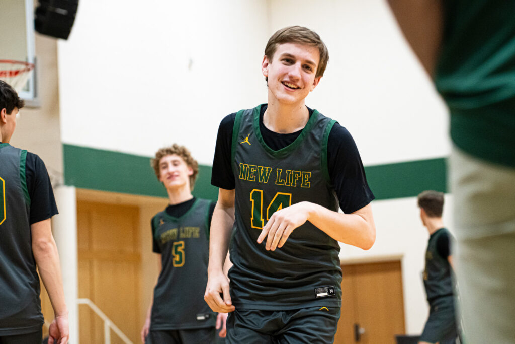 NLA Varsity Boys Basketball player in action during the 2022–2023 season, featuring alumni athlete Tony Gargaro on the court.