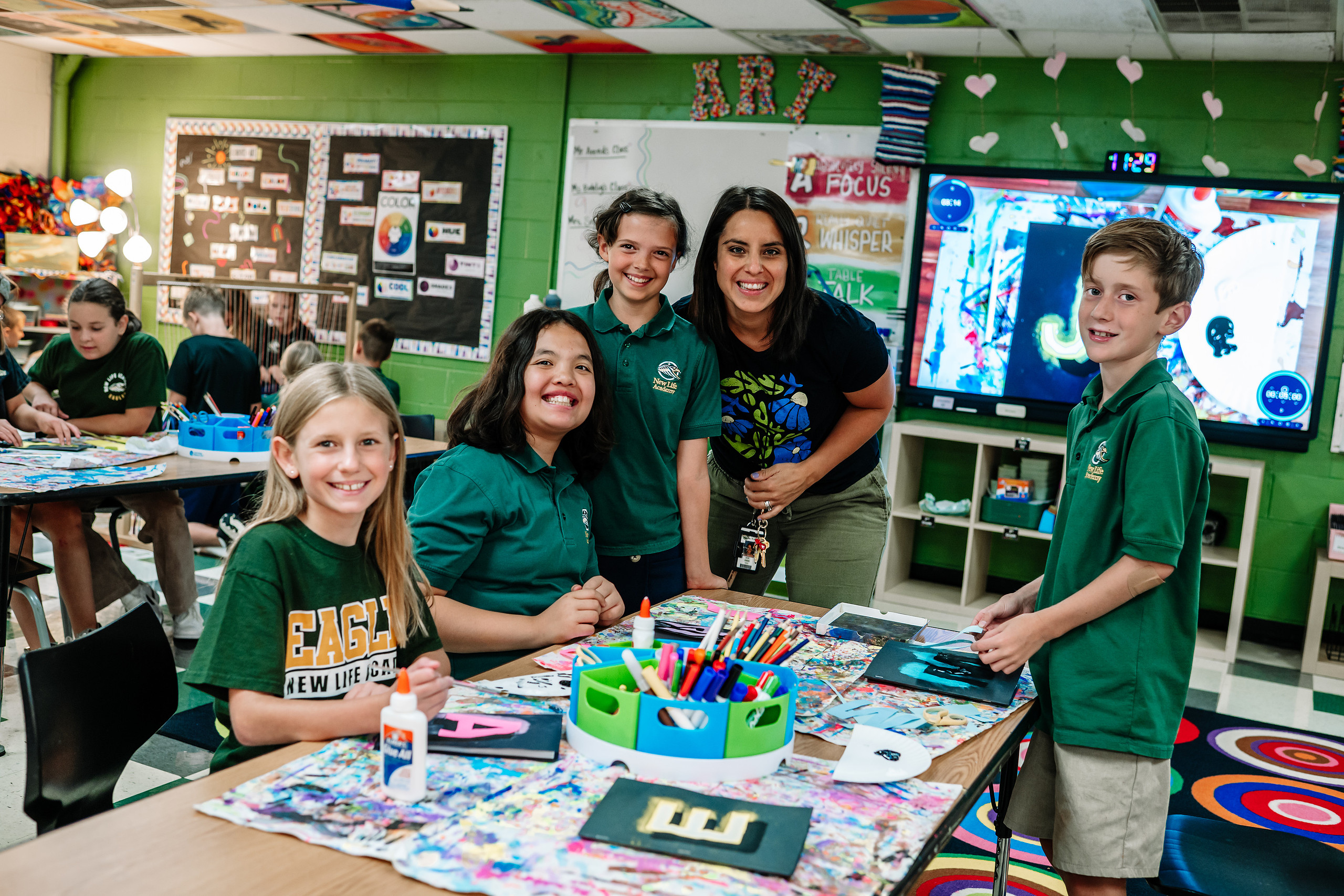 New Life Middle School English Teacher Dan Nelson interacts with students in class