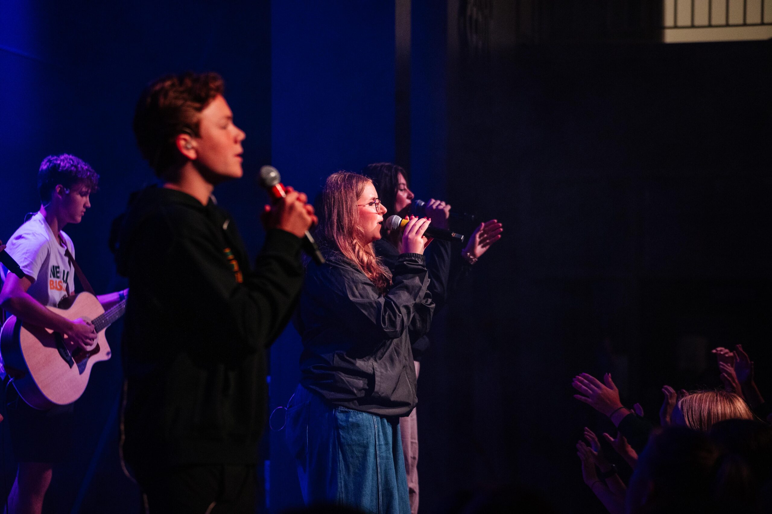 Students leading worship during chapel at New Life Academy