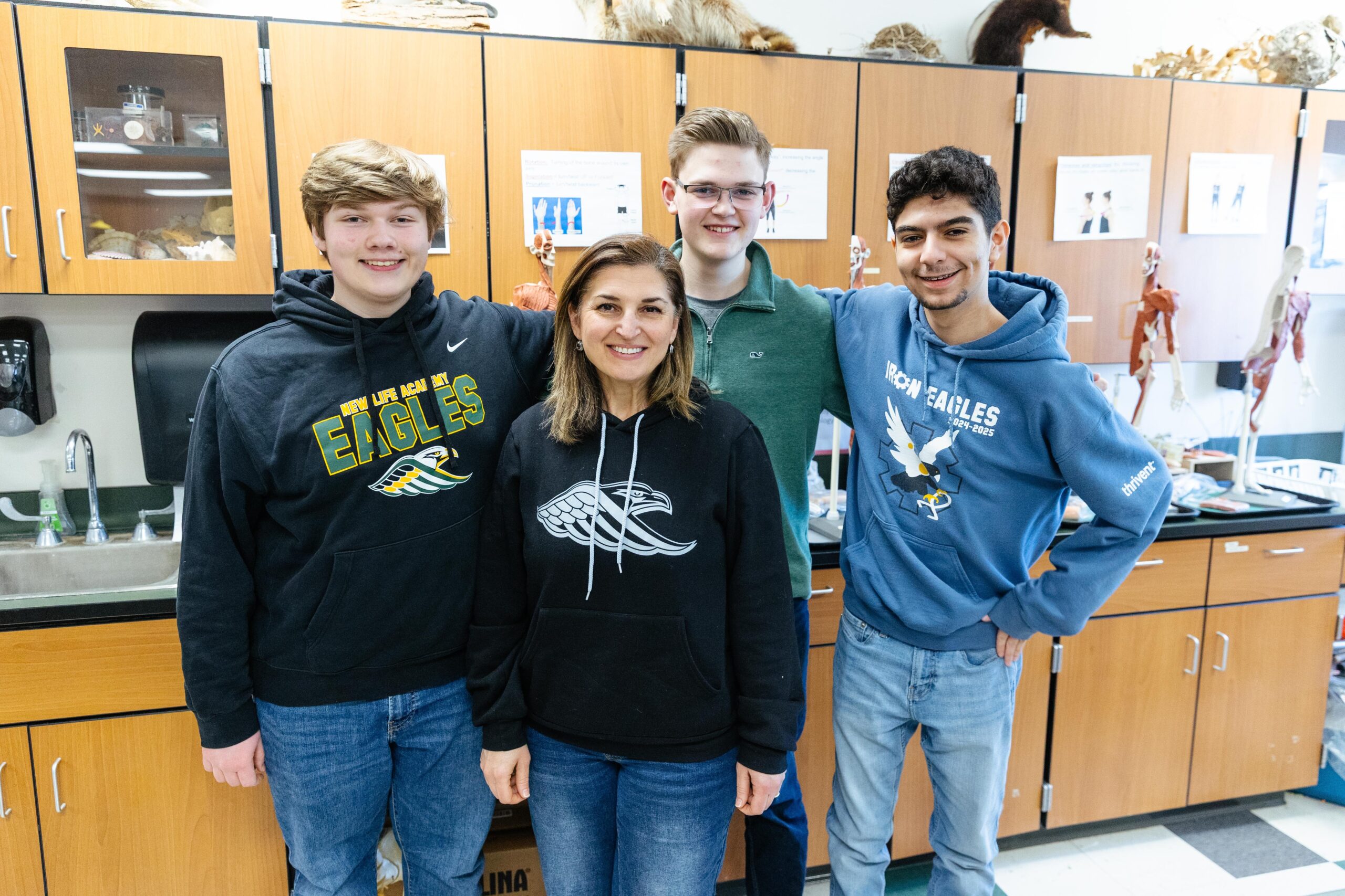 Senior Teaching Assistant Kayden and Kindergarten teacher Monica Doherty standing together in a New Life Academy classroom.