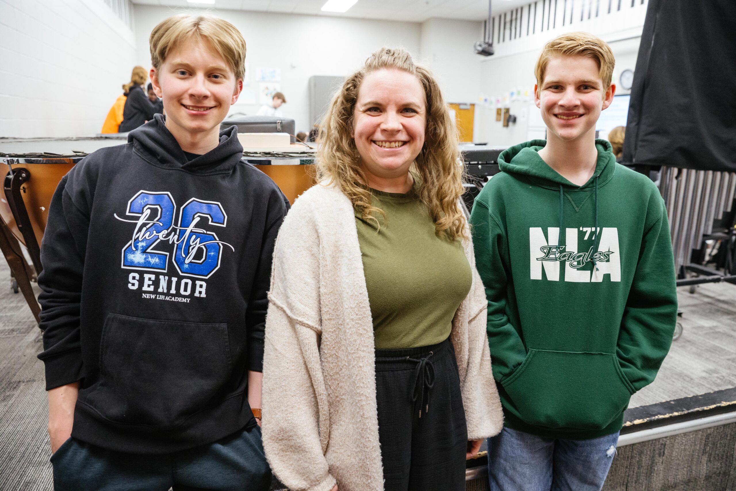 Senior Teaching Assistant Kayden and Kindergarten teacher Monica Doherty standing together in a New Life Academy classroom.