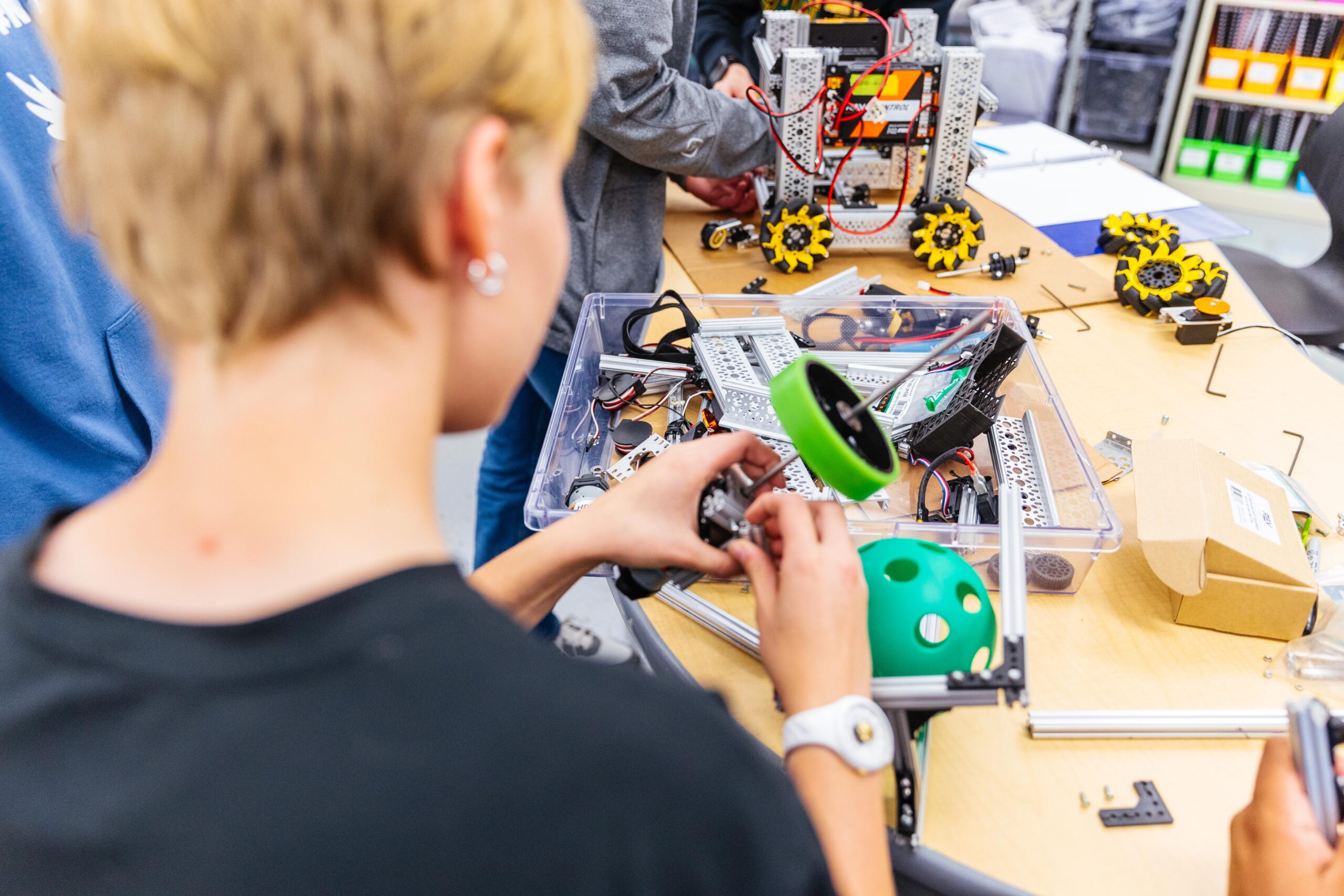 New Life Academy student assembling robotics components created with 3D printing technology supported by Annual Fund donors.